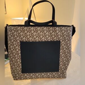 Beautiful tan/cream/black DKNY purse.